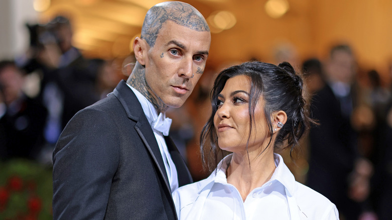Kourtney Kardashian looking at Travis Barker