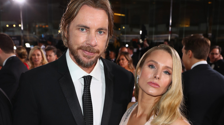 Dax Shepard smiling, Kristen Bell pouting