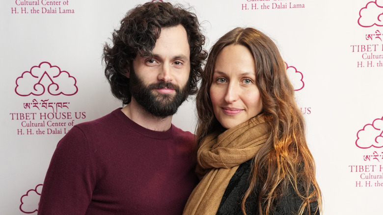 Penn Badgley and Domino Kirke smiling