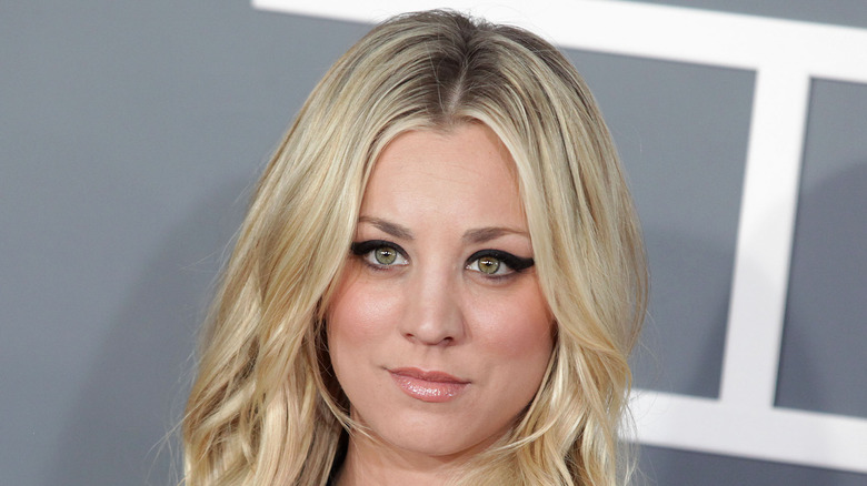 Kaley Cuoco posing at event