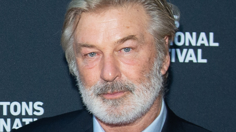 Alec Baldwin wearing a blue suit 