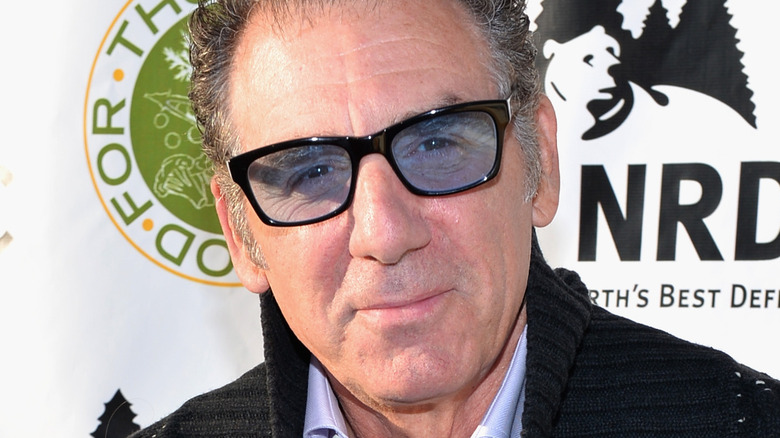 Michael Richards wearing blue tinted glasses