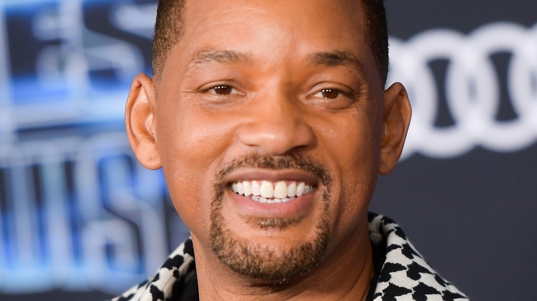 Will Smith wearing a plaid jacket 