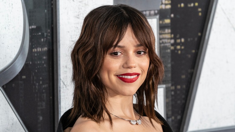 Jenna Ortega red lipstick wavy hair