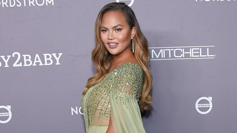 Chrissy Teigen looking to the side