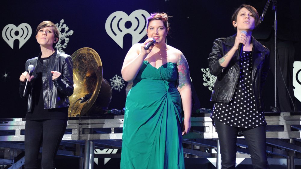 Sara Quin, Mary Lambert, Tegan Quin on stage performing