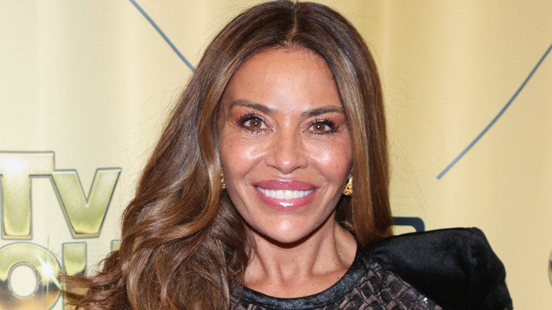 Dolores Catania smiles at a red carpet event