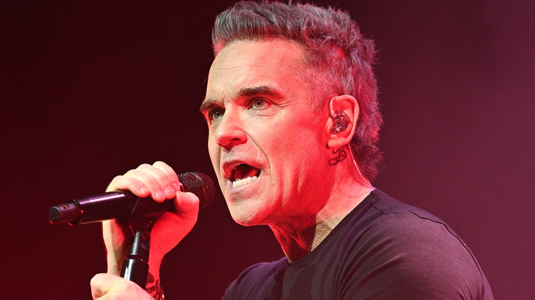 Pop star Robbie Williams performing on-stage