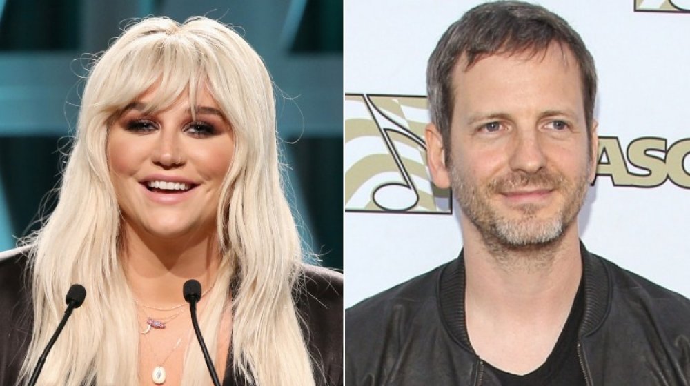 Kesha on stage, Dr. Luke in front of white wall