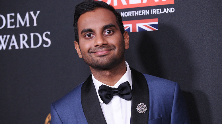 Aziz Ansari wearing a blue suit