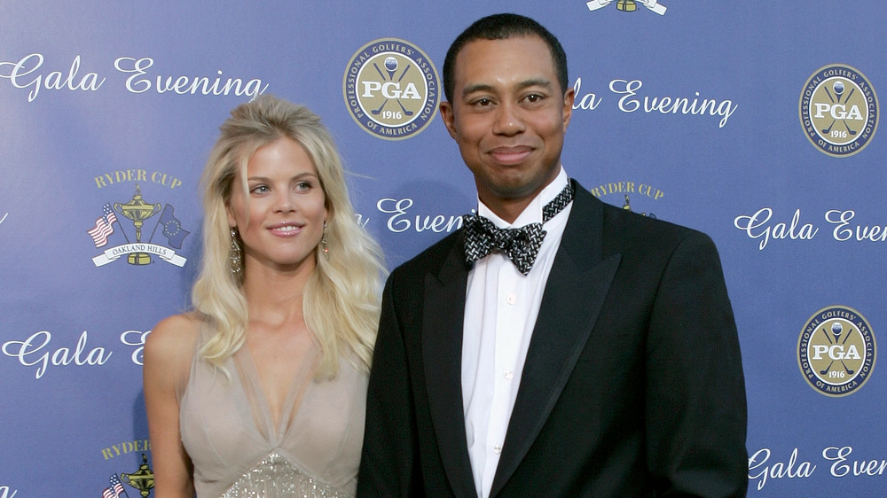 Elin Nordegren and Tiger Woods smiling
