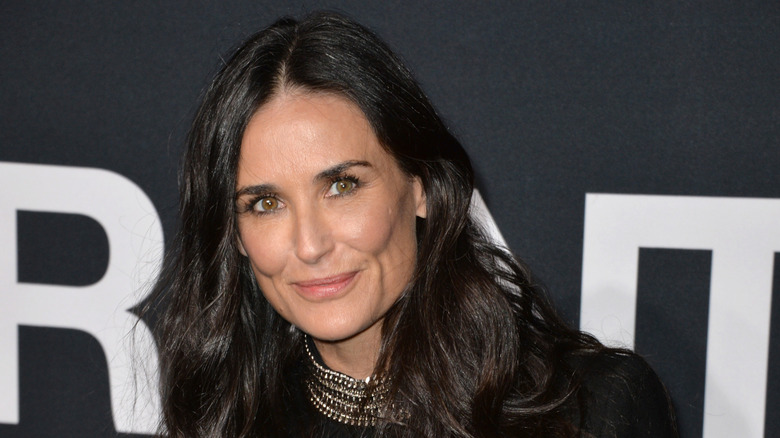 Demi Moore wearing black and smiling