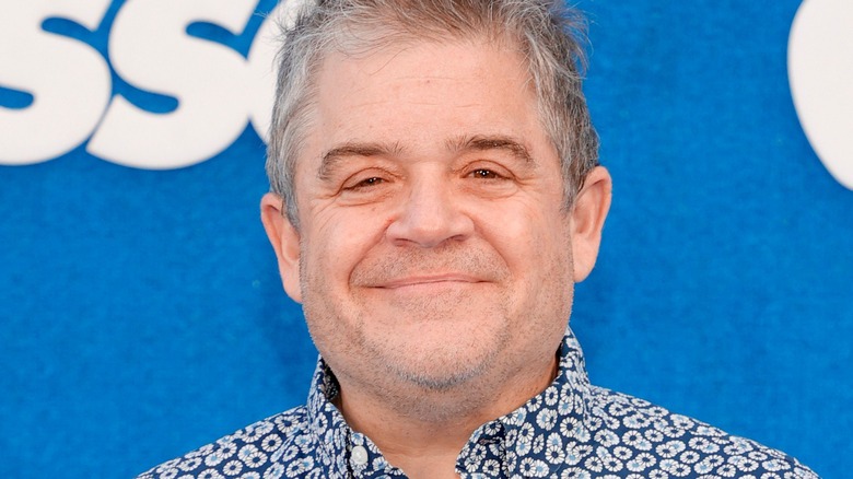 Patton Oswalt wearing a floral print shirt