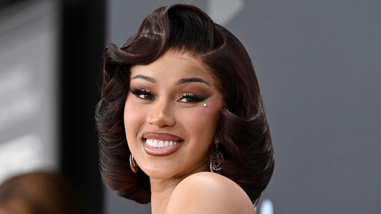 Cardi B smiles at the Grammy Awards