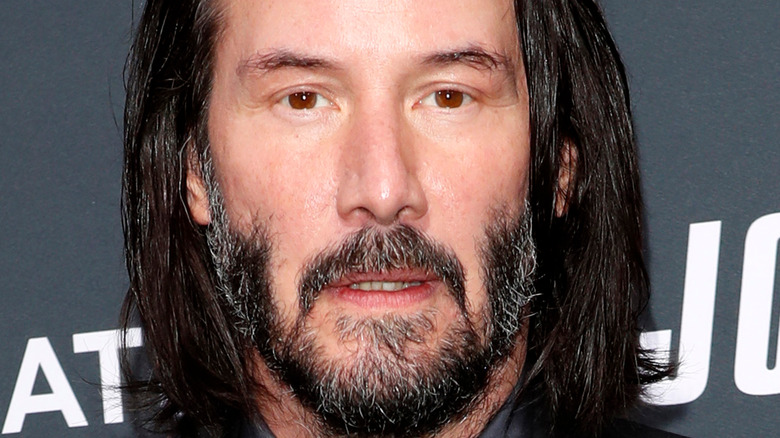 Keanu Reeves glares