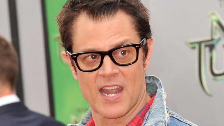Johnny Knoxville mouth open glasses