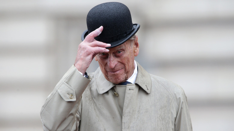 Prince Phillip tipping hat