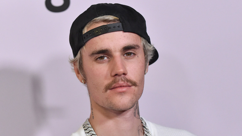 Justin Bieber in a black hat