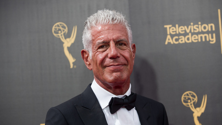 Anthony Bourdain poses in a tux in 2017
