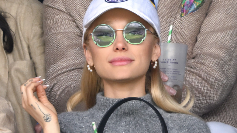 Ariana Grande sunglasses baseball hat London 2023
