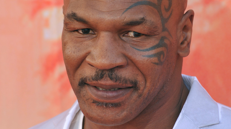 Mike Tyson poses for a photo