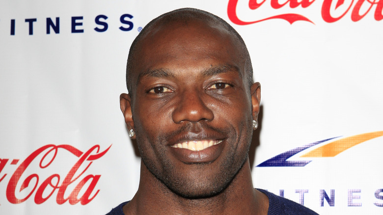 Terrell Owens poses for a photo