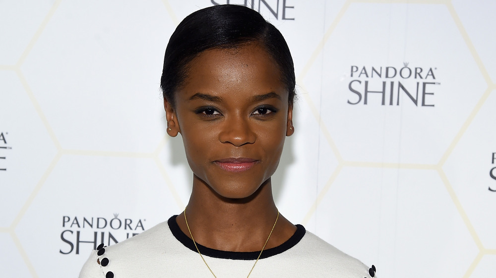 Letitia Wright smirking 