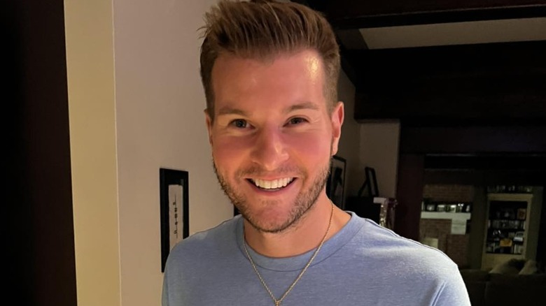 Justin Fabus smiles at home