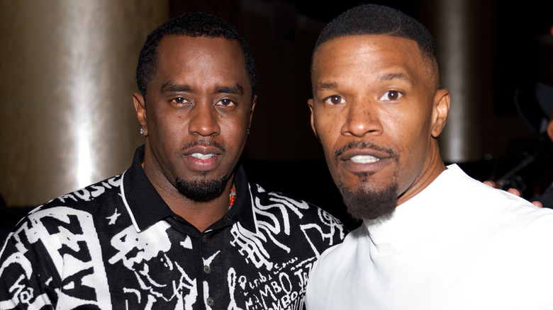 Diddy and Jamie Foxx posing together at an event.