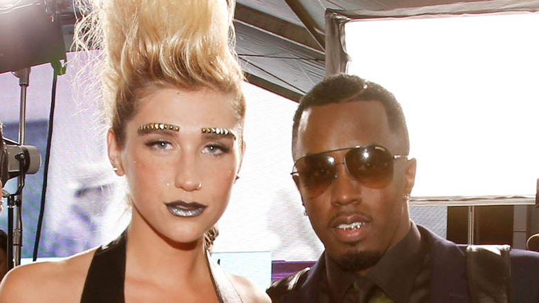 Kesha and Diddy posing together.