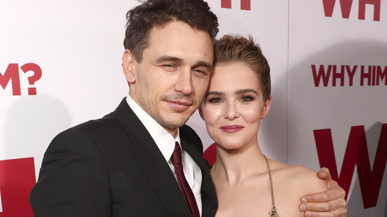 James Franco with arm around Zoey Deutch