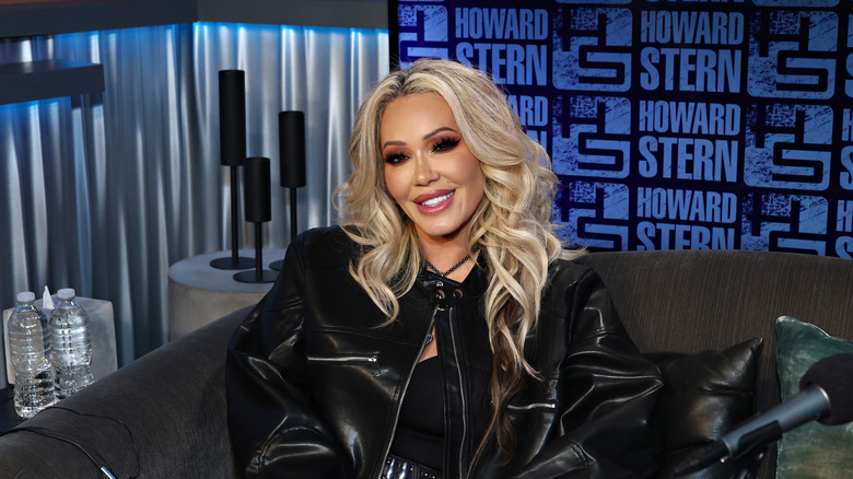 Bunnie Xo sits in the Howard Stern Show stud