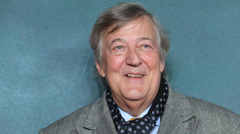 Stephen Fry poses in 2024