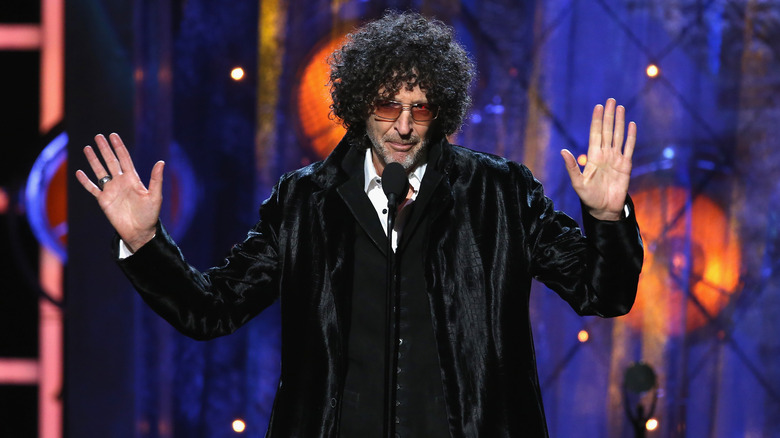 Howard Stern holding his hands up