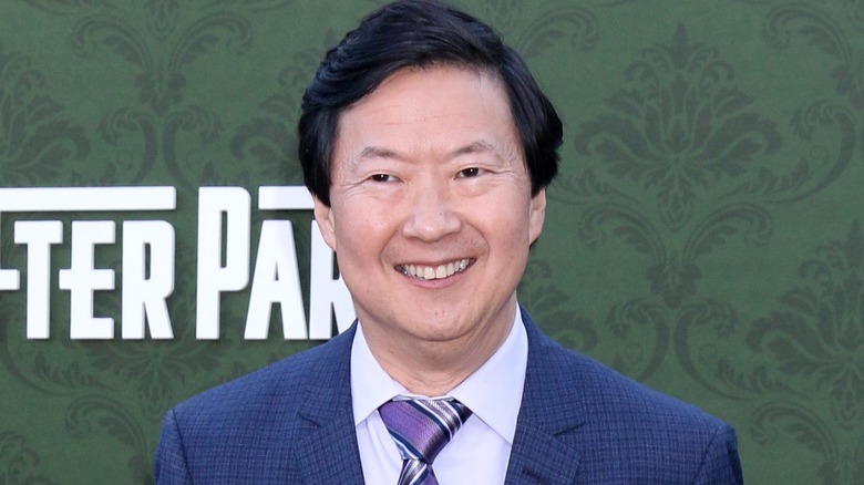 Ken Jeong smiling in blue suit