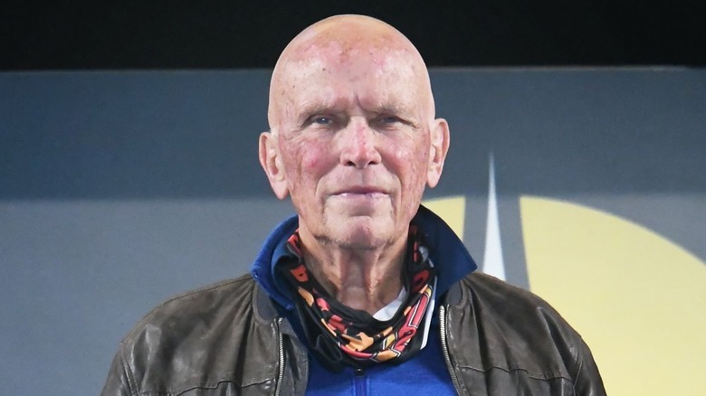 Peter Weller posing on stage