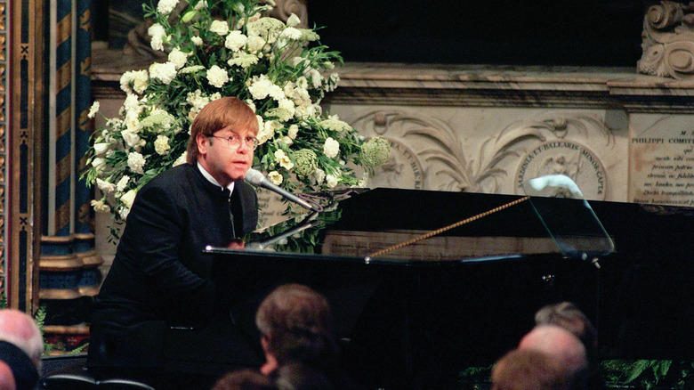 Elton John playing the piano