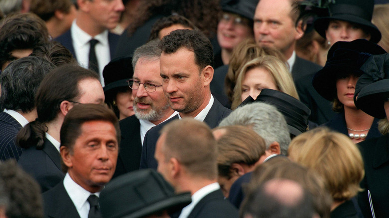 Tom Hanks standing in a crowd