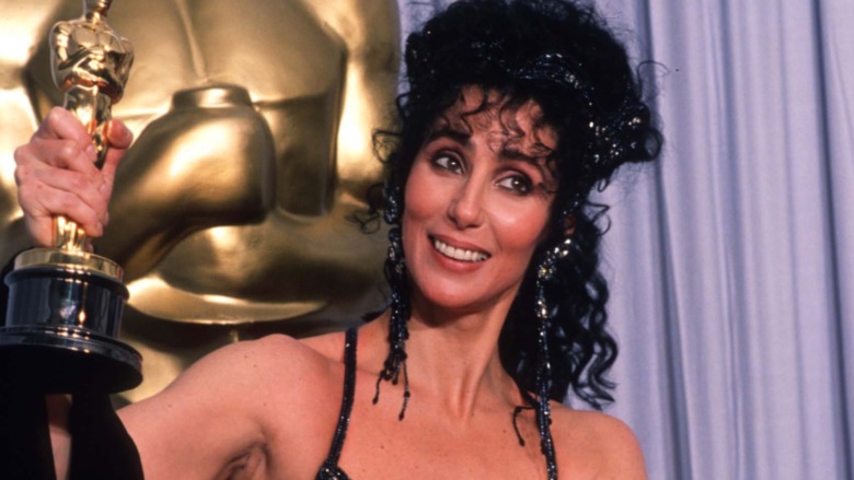 Cher holding her Oscar