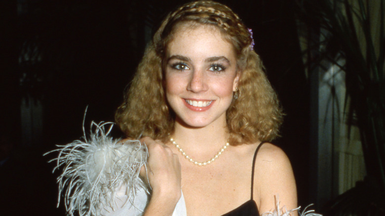 Dana Plato smiling in a black dress