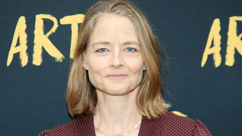 Jodie Foster smirking red on the carpet
