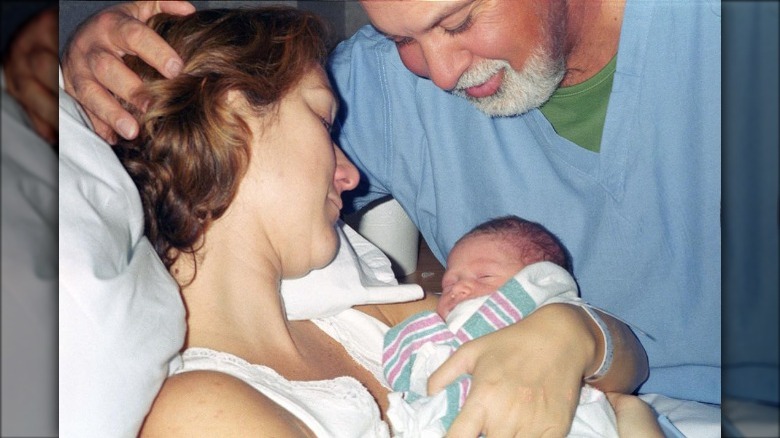 Rene Angelil and Celine Dion holding René-Charles Angelil