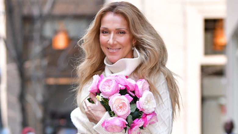 Celine Dion holding flowers