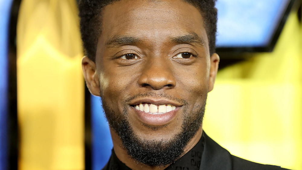 Chadwick Boseman smiling on the red carpet