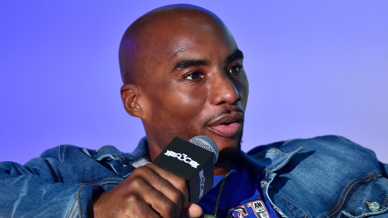 Charlamagne tha God speaking into microphone 