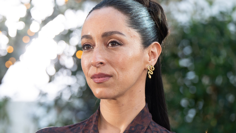 Oona Chaplin wearing snake earrings