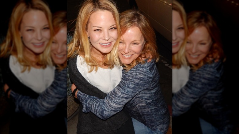 Jordan and Cheryl Ladd hug and smile