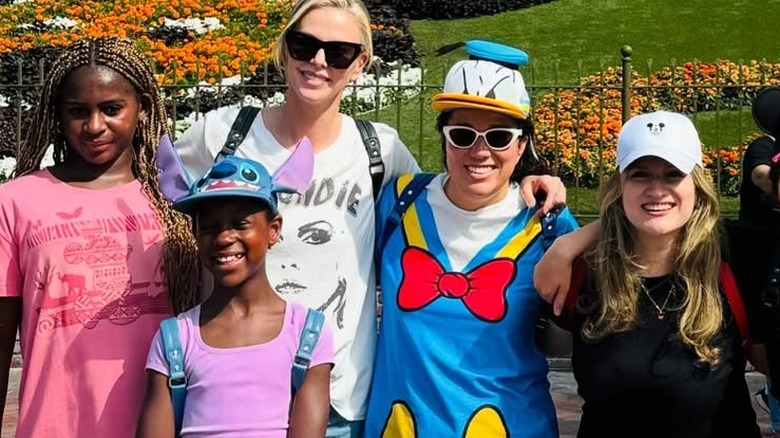 Charlize Theron at Disneyland with her daughters.