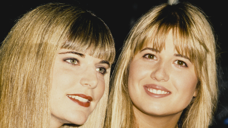 Musicians Chance and Chaz Bono both with long blonde hair and bangs