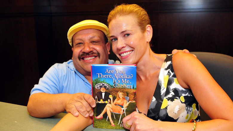 Chelsea Handler with Chelsea Lately sidekick Chuy displaying a copy of her book